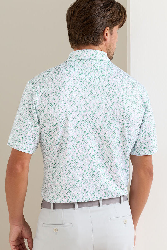 man wearing polo shirt turned around showing the back