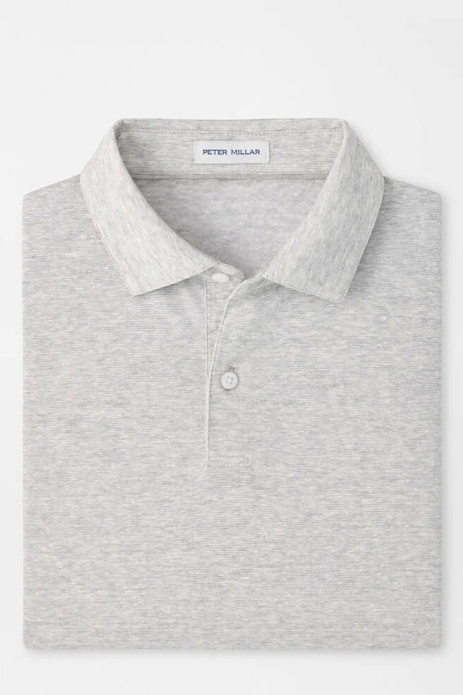 Gray polo shirt with 'Peter Millar' label on a white background