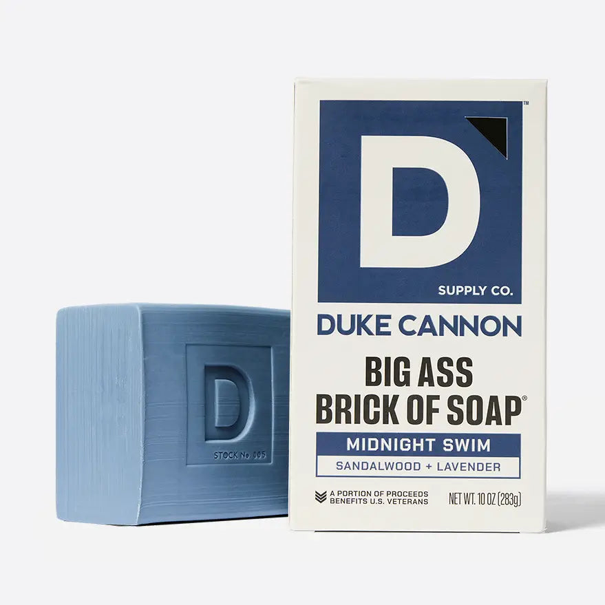Blue soap bar and Duke Cannon packaging on a white background