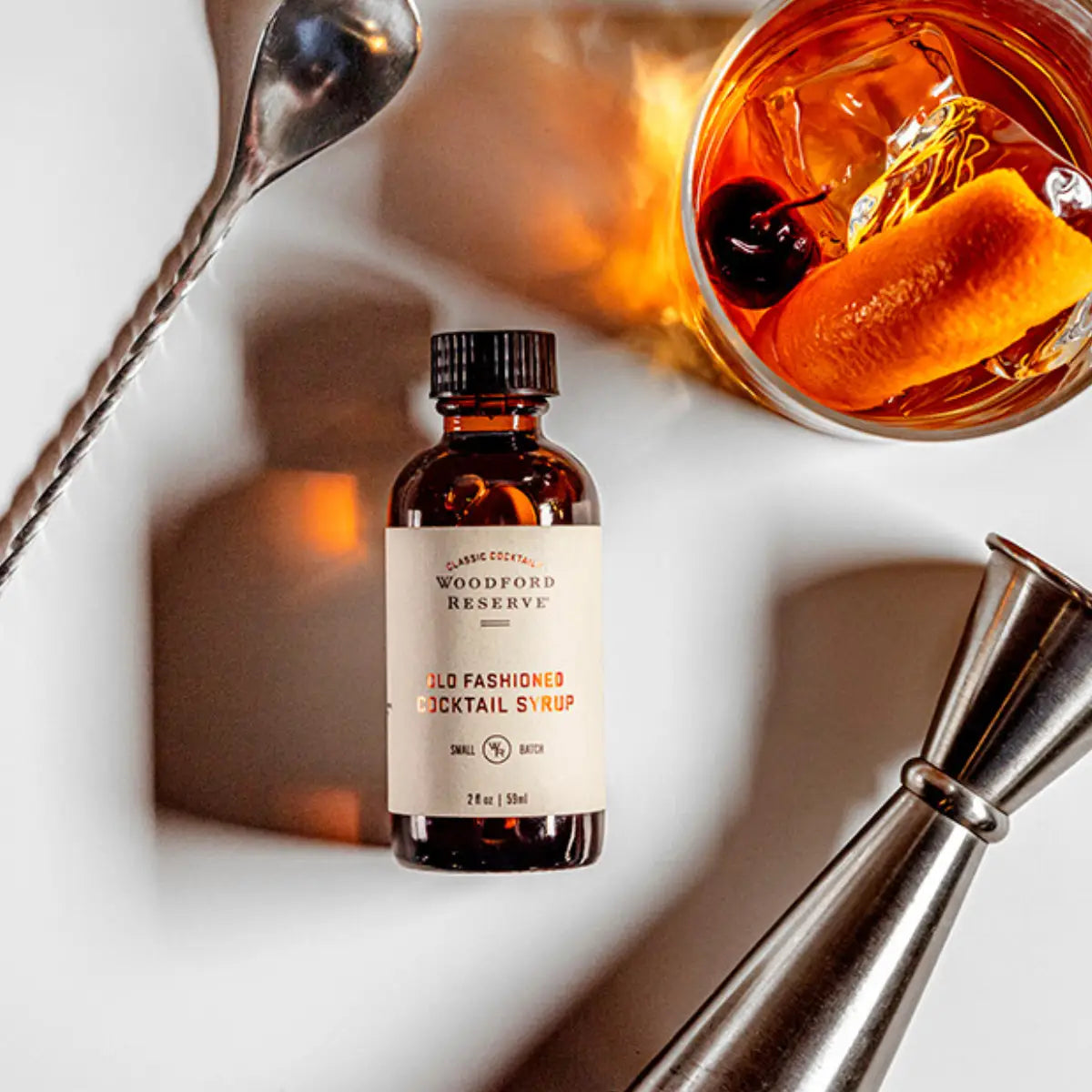 Bottle of Absinthe with cocktail ingredients on a white background