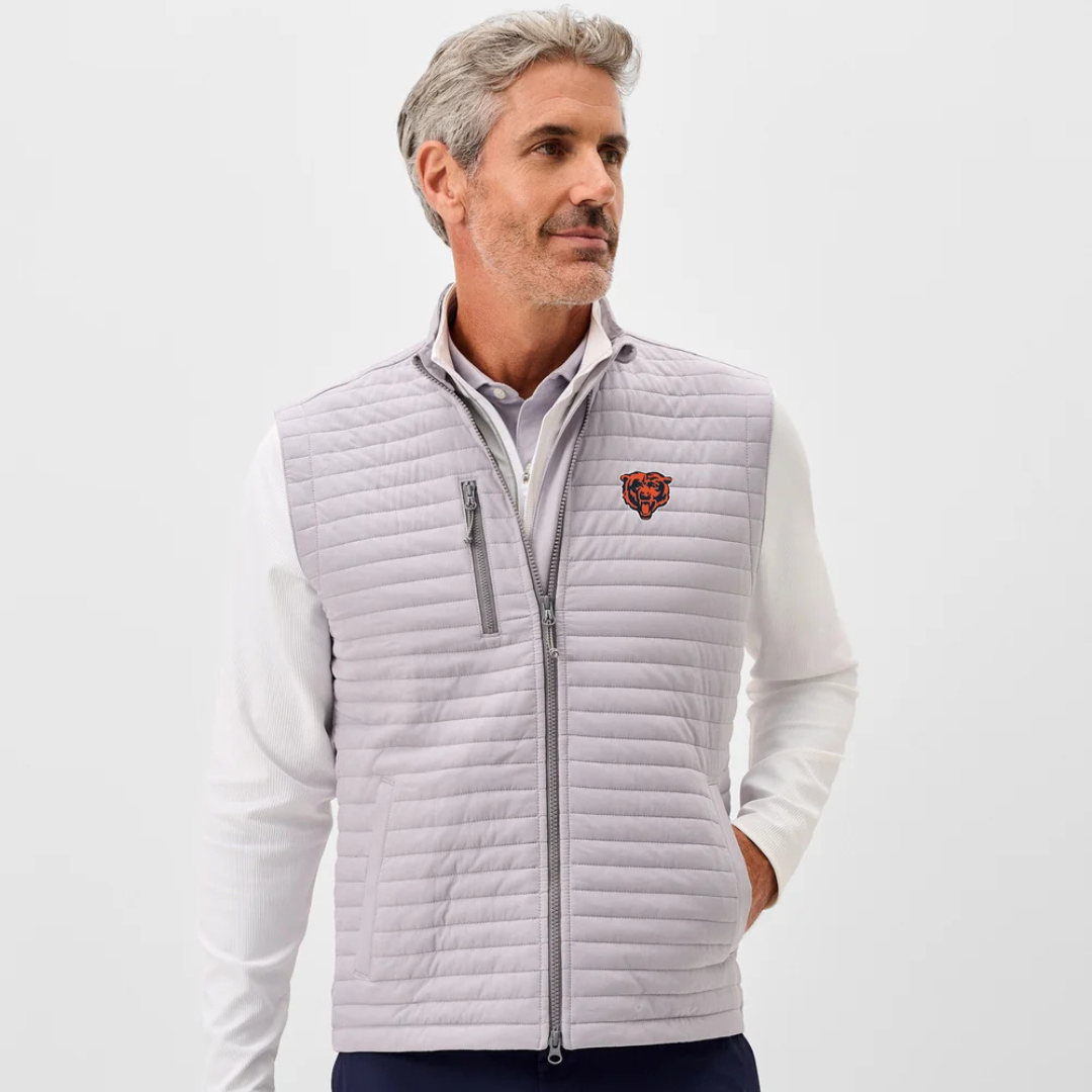 Man wearing a light gray quilted vest with a logo on a white background