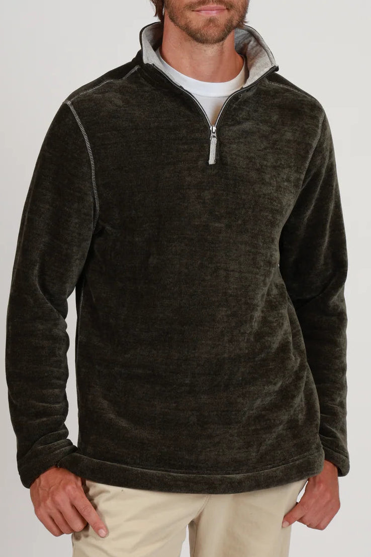 man in quarter zip