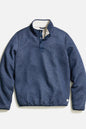 A navy blue quilted pullover jacket with a half-button placket and a light beige lining visible at the collar, shown flat on a light gray background.