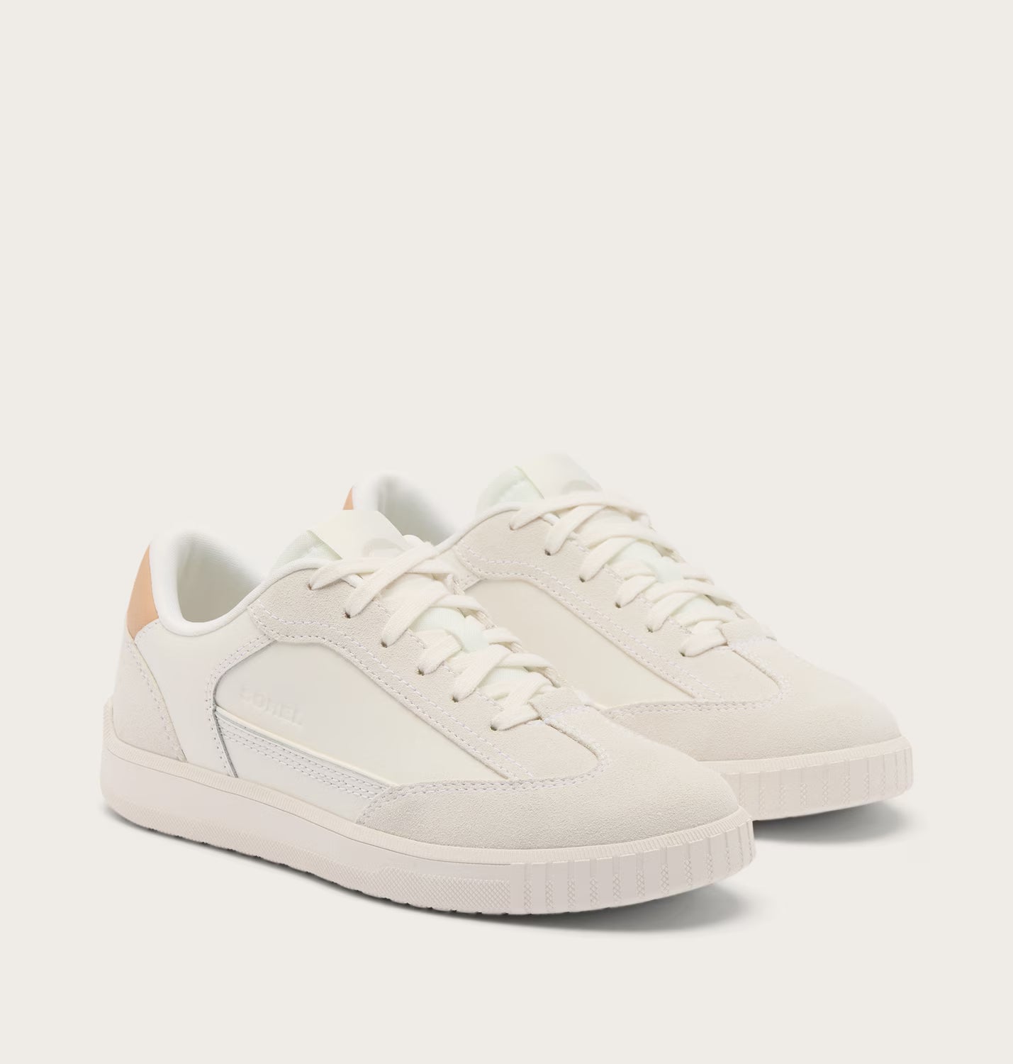 Pair of white sneakers on a light gray background