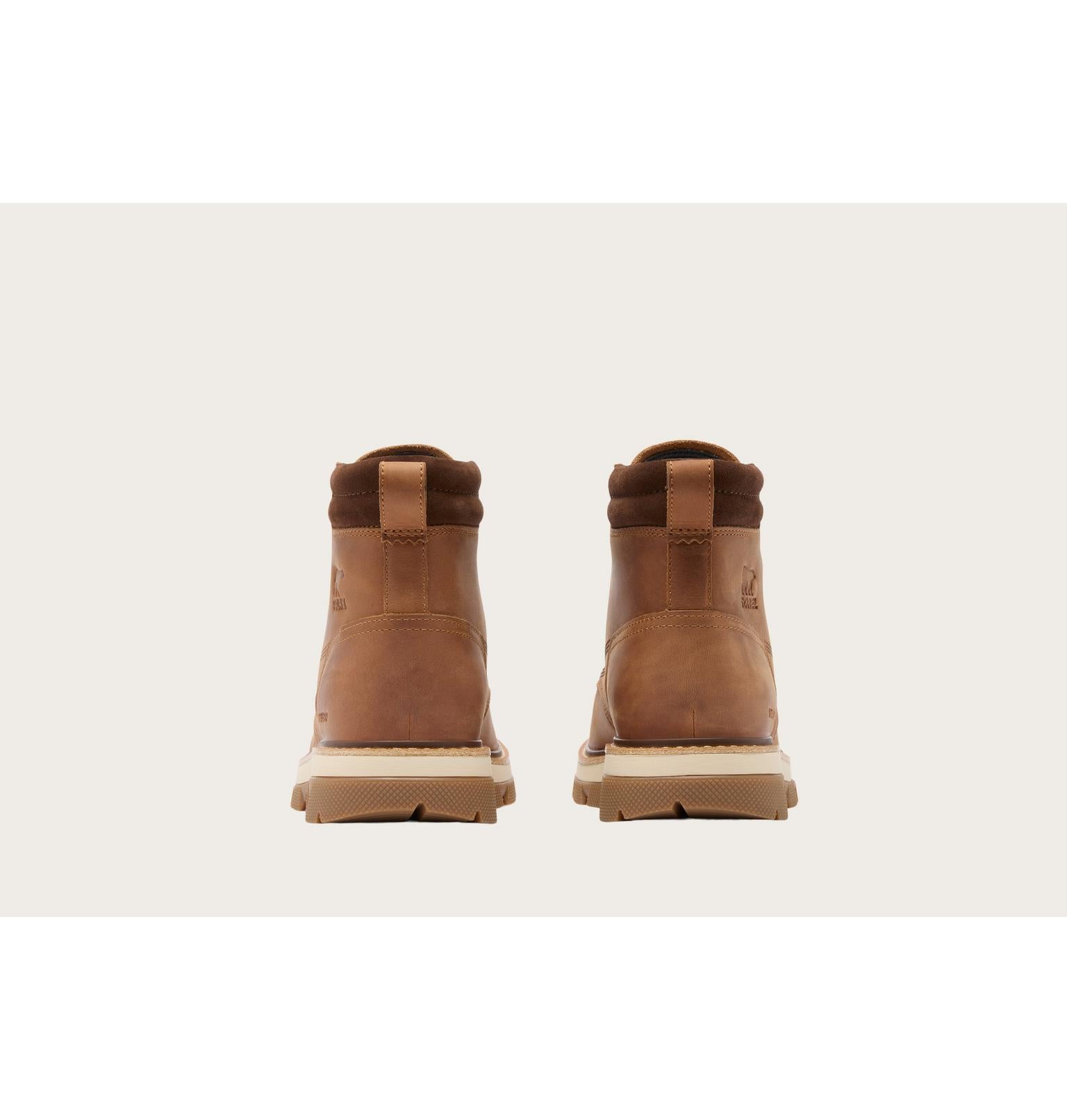A pair of brown leather ankle boots shown from the back, featuring a pull tab and thick beige soles, set against a light beige background.