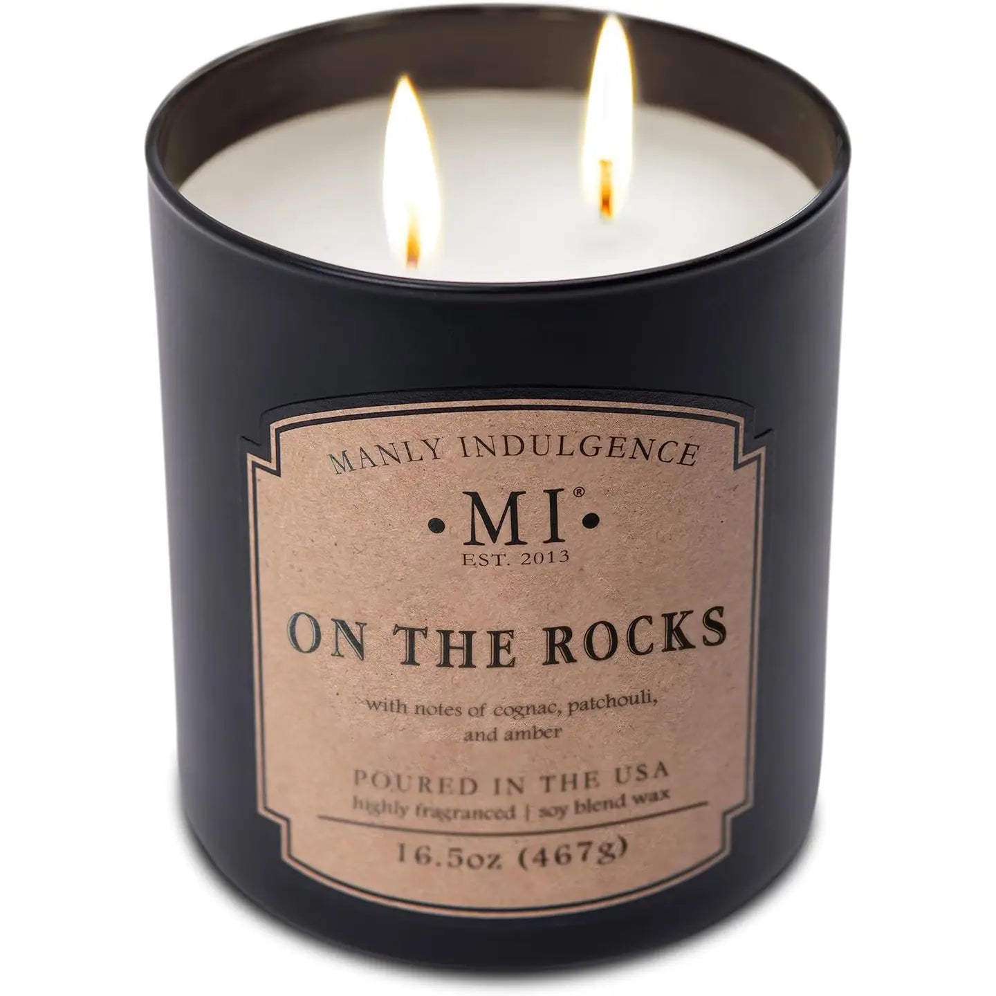 Candle in a black container with 'Manly Indulgence' label on a white background