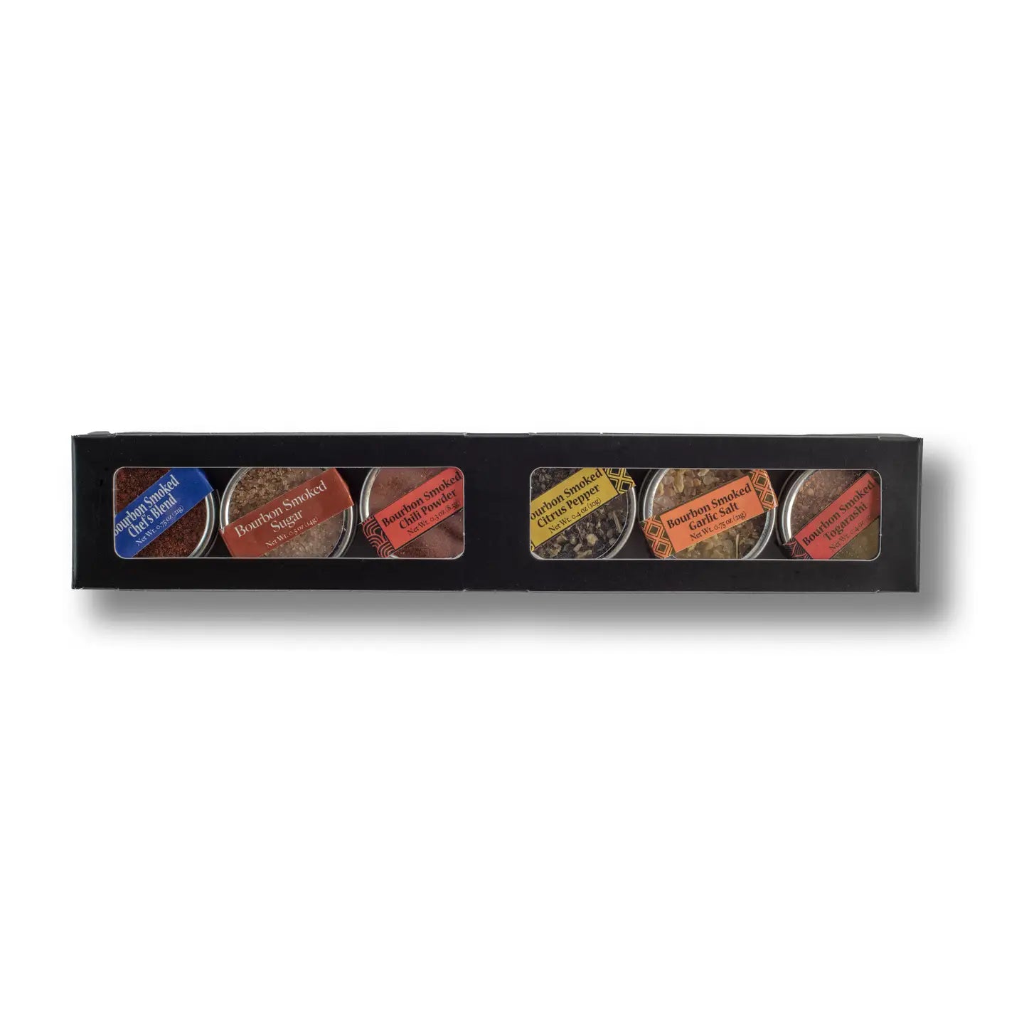 Set of six small containers with labels in a black box on a white background