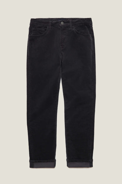 Black corduroy pants with rolled cuffs, displayed flat against a light beige background.