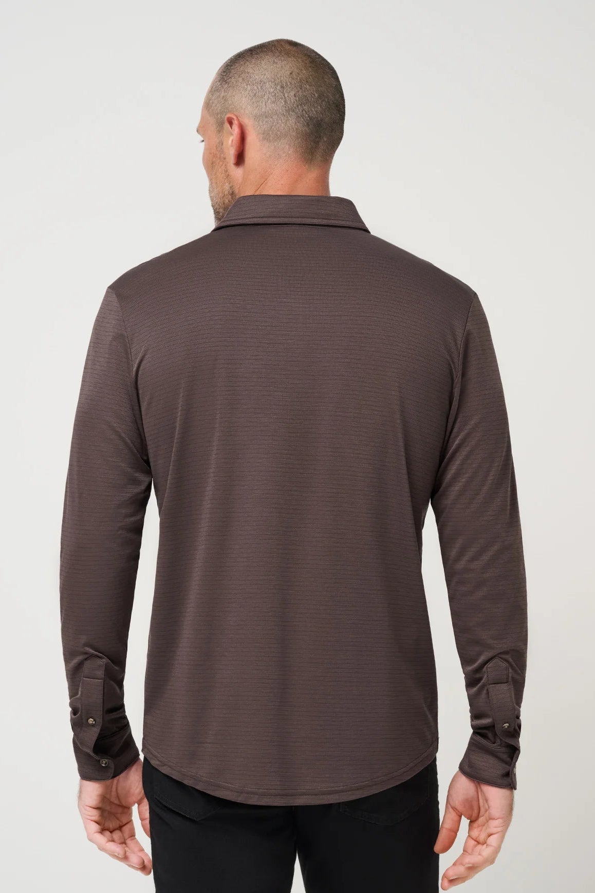 man in long sleeve polo