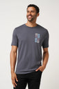 Man wearing a gray t-shirt with a colorful graphic on a white background