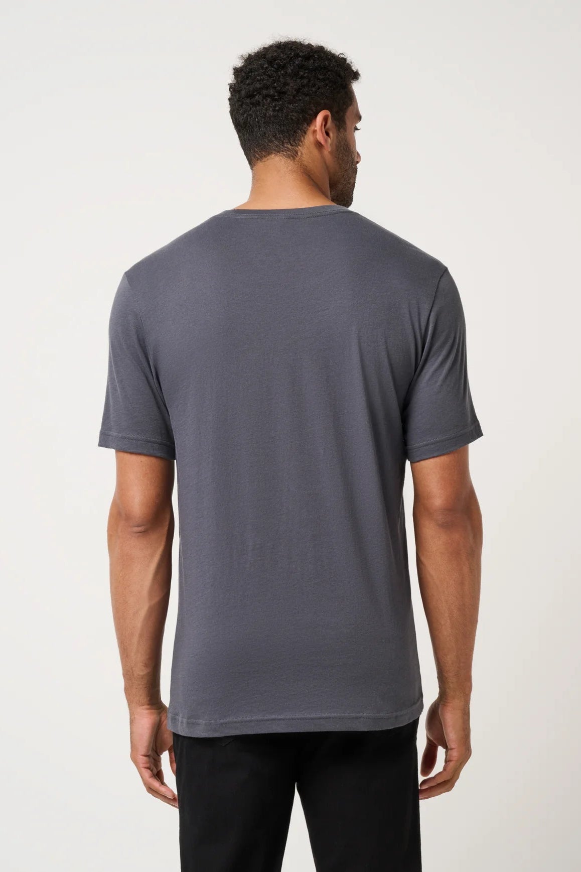 Man wearing a gray t-shirt on a white background