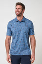 Man wearing a blue patterned polo shirt against a plain background