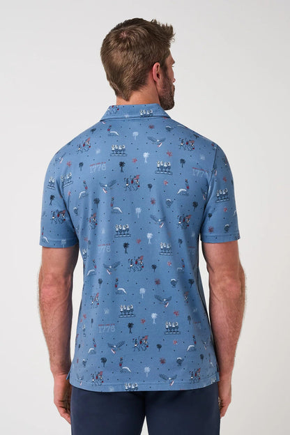 Man wearing a blue patterned polo shirt on a white background