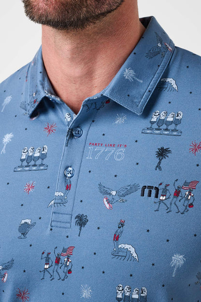 Close-up of a blue patterned shirt with graphics and text.