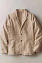 A light beige linen-blend blazer jacket with notch lapels, a two-button front closure, and two large front patch pockets, laid flat against a neutral light gray background.