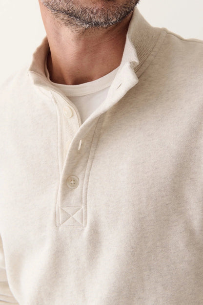 close up of buttons on pullover