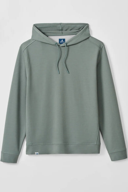 A sage green pullover hoodie with matching drawstrings, displayed flat against a light gray background. The hoodie features a small blue brand tag on the inside neck and a tiny white tag near the bottom hem.