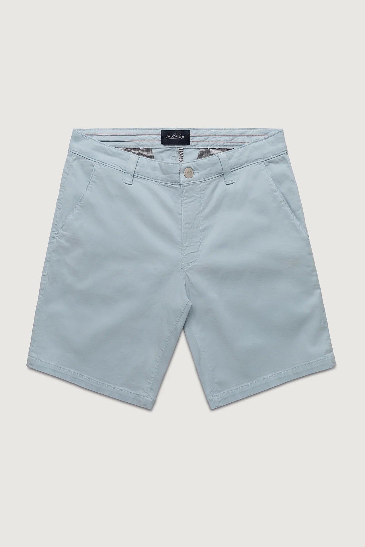 Light blue shorts with a brand label on a light gray background