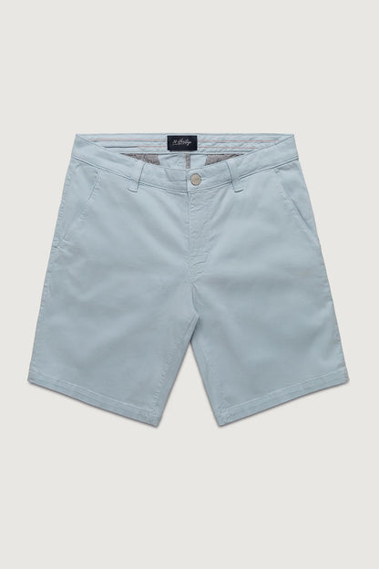 Light blue shorts with a brand label on a light gray background