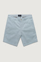 Light blue shorts with a brand label on a light gray background