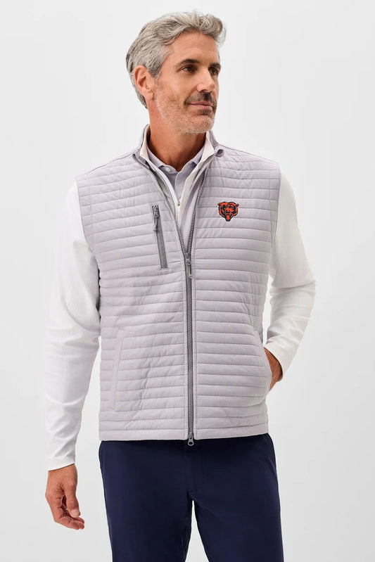 Man wearing a light gray quilted vest with a logo on a white background
