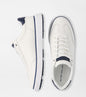 White sneakers with navy accents on a white background
