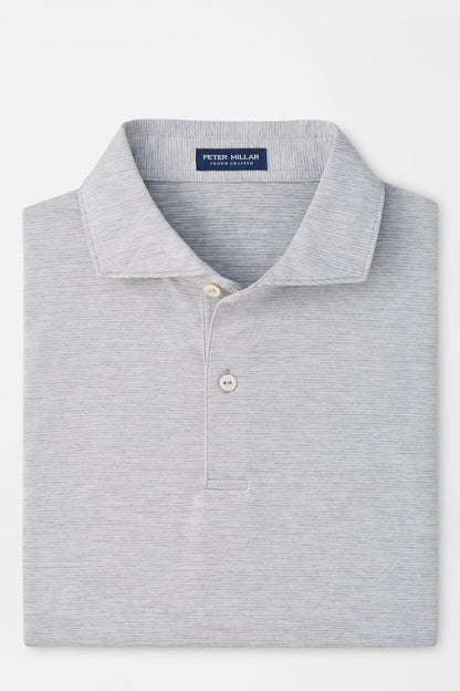 A folded light gray heathered polo shirt by Peter Millar, featuring a classic collar, two-button placket, and a clean white background.
