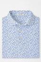 Blue floral patterned shirt on a light gray background