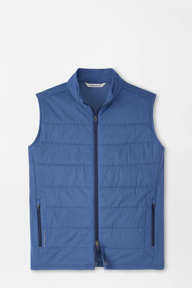 Blue puffer vest on a light gray background