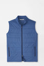 Blue puffer vest on a light gray background