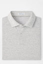 Gray polo shirt with 'Peter Millar' label on a white background