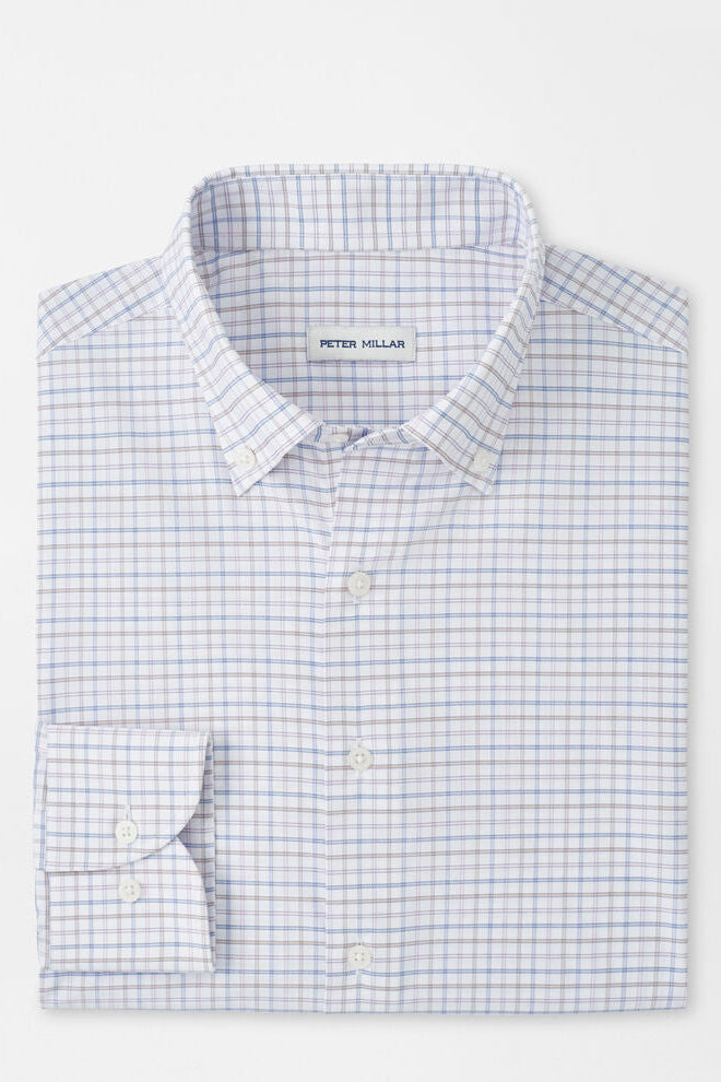 Folded checkered shirt with 'Peter Millar' label on a white background