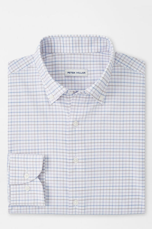 Folded checkered shirt with 'Peter Millar' label on a white background