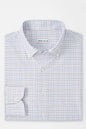 Folded checkered shirt with 'Peter Millar' label on a white background