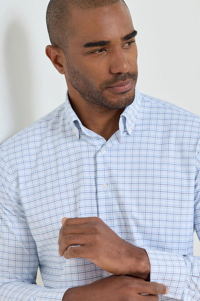 man wearing blue checkered dress shirt