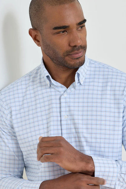 man wearing blue checkered dress shirt