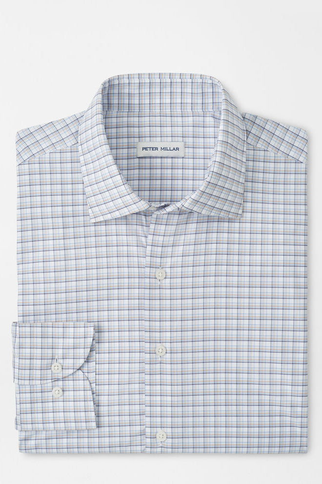 Folded checkered shirt with 'Peter Millar' label on a light gray background