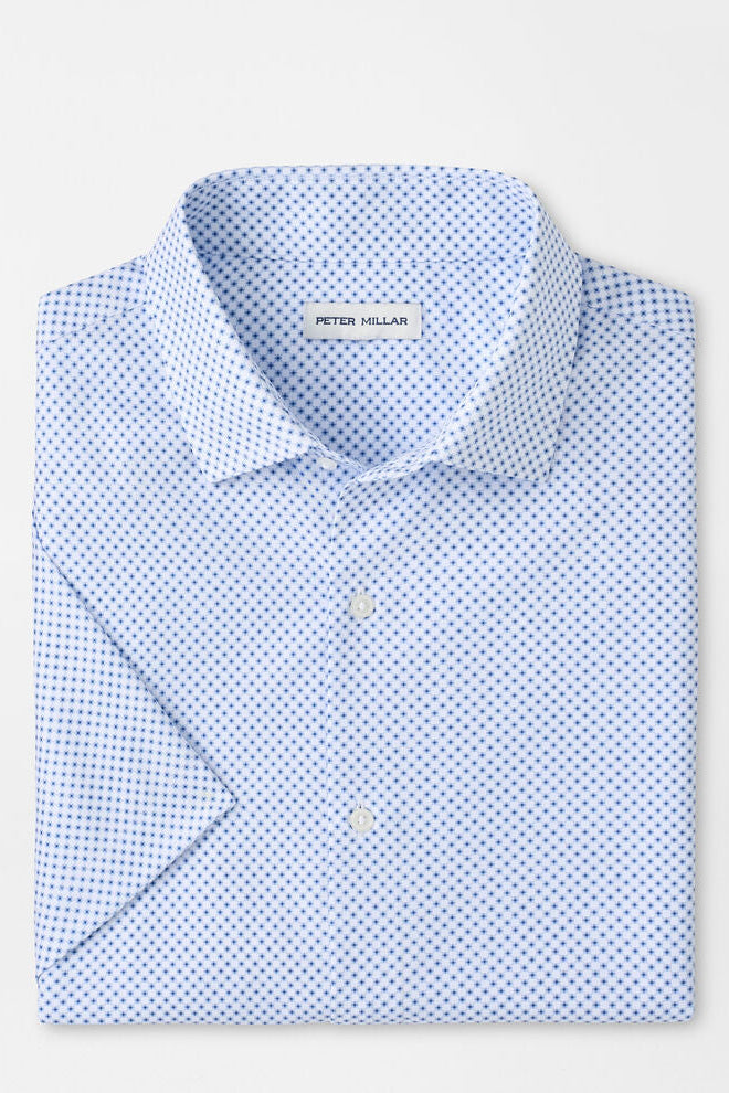 Blue patterned shirt with Peter Millar label on a light gray background