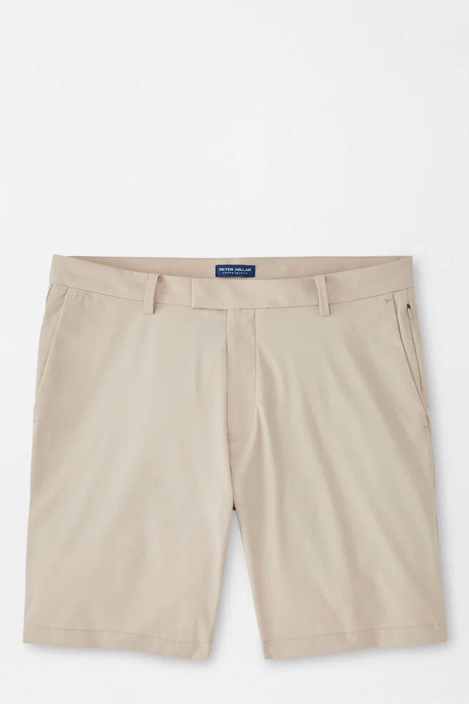 Beige shorts with a brand label on a white background