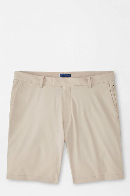 Beige shorts with a brand label on a white background