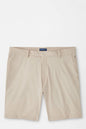 Beige shorts with a brand label on a white background