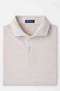 Folded striped polo shirt with a brand label on a white background