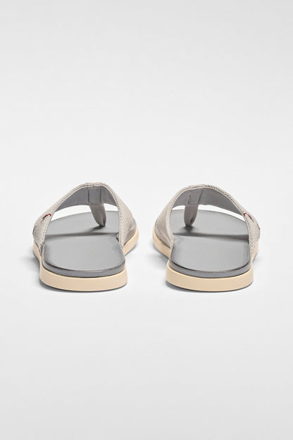 Pair of sandals on a light gray background