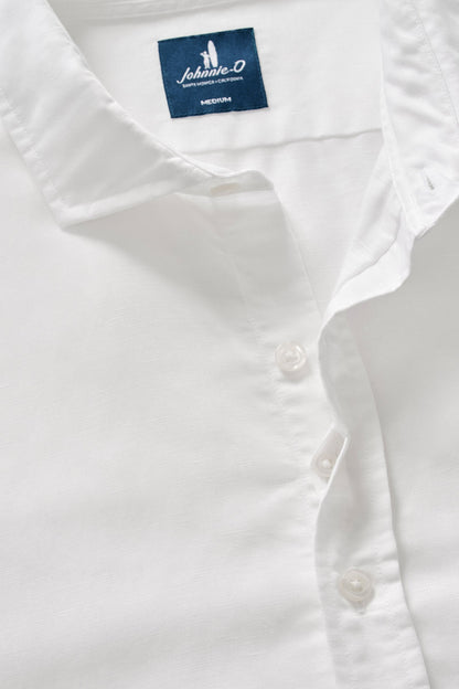White shirt with a Johnson & Johnson label on a light gray background