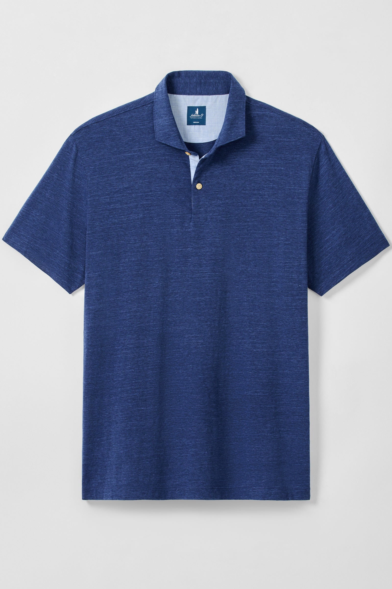 Blue polo shirt on a light gray background