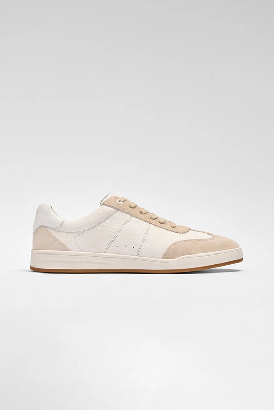 White and beige sneaker on a light gray background