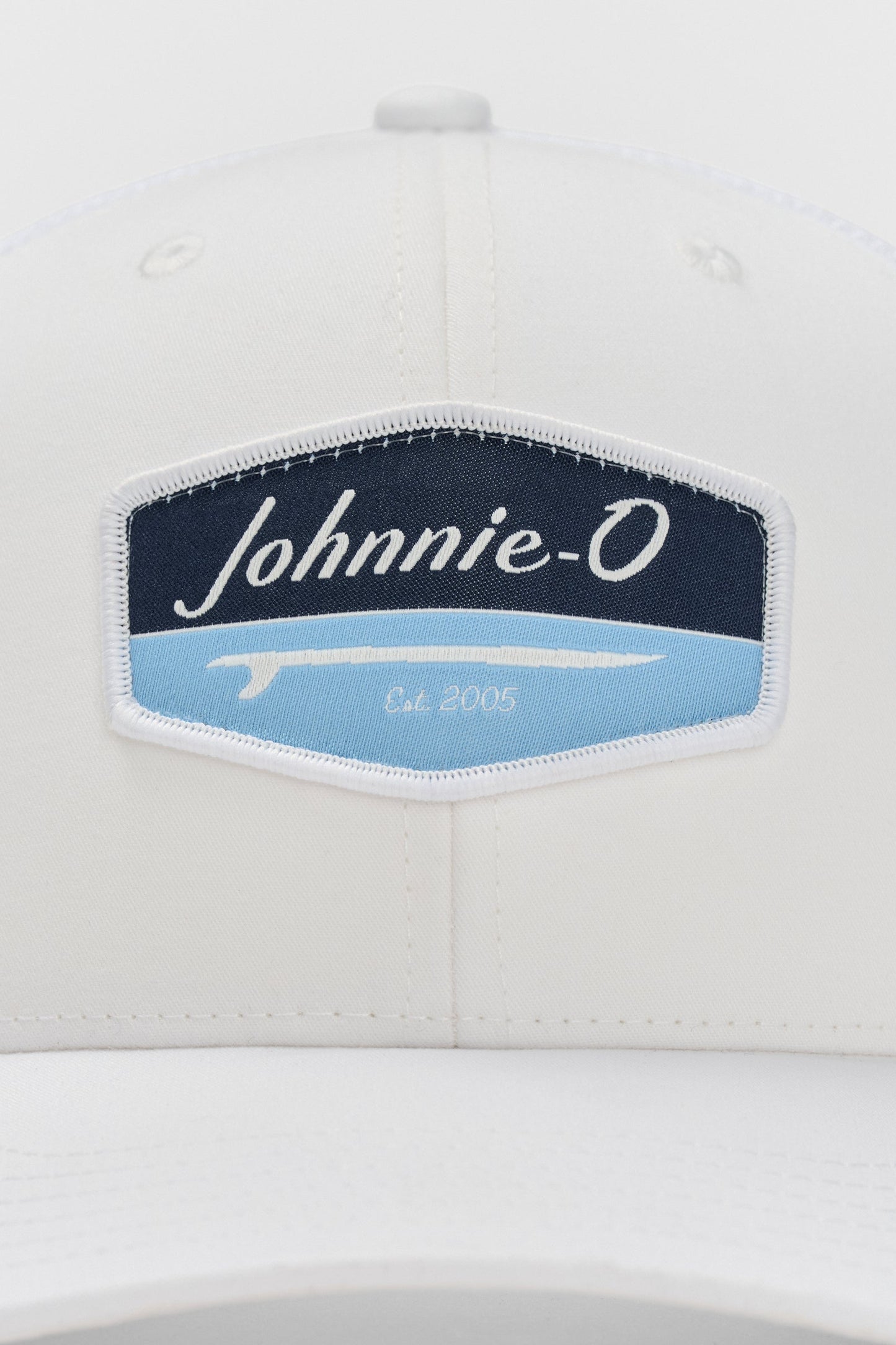 White cap with a 'Johnnie-O' logo on a white background