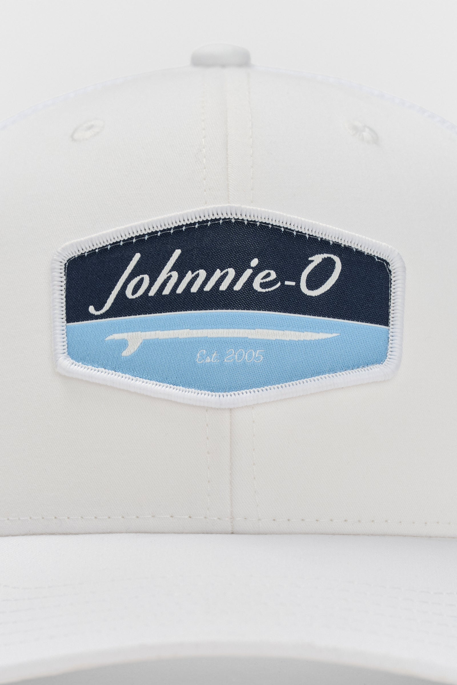 White cap with a 'Johnnie-O' logo on a white background