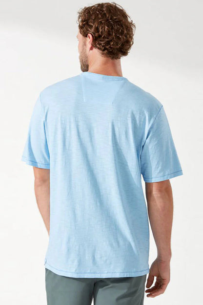 Man wearing a light blue t-shirt on a white background