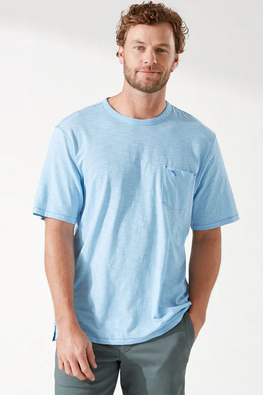 man wearing light blue t-shirt against white background